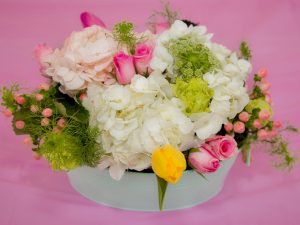 Flower basket with pink roses